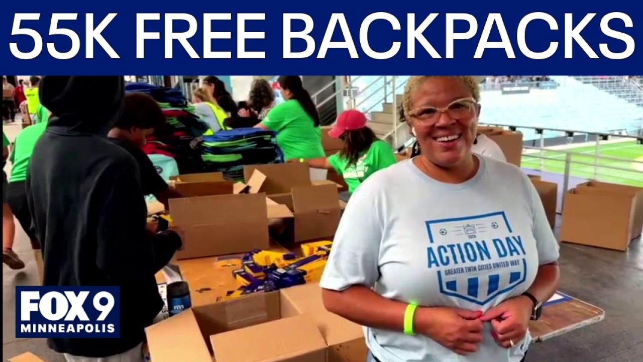 Volunteers fill backpacks with school supplies for 55,000 students