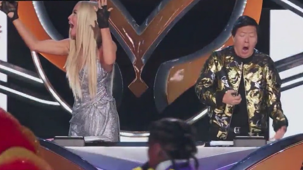 Reality star unmasked on 'The Masked Singer'