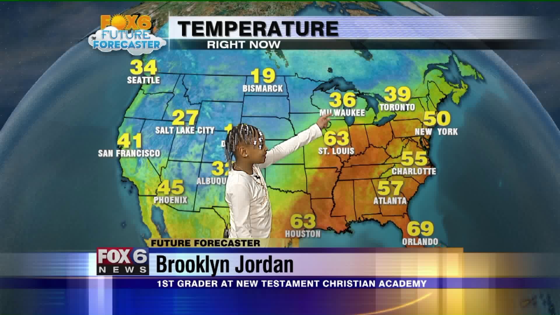 Brooklyn helps Meteorologist Rob Haswell with the weather