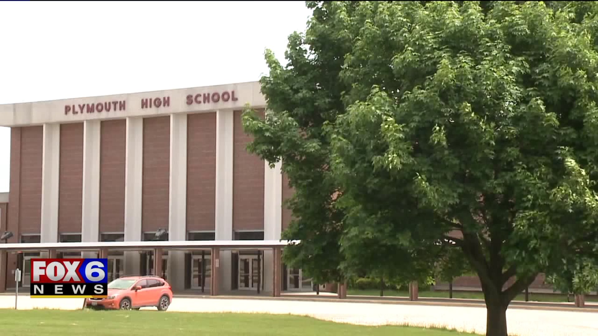 Parking lot plan could mean removal of memorial tree