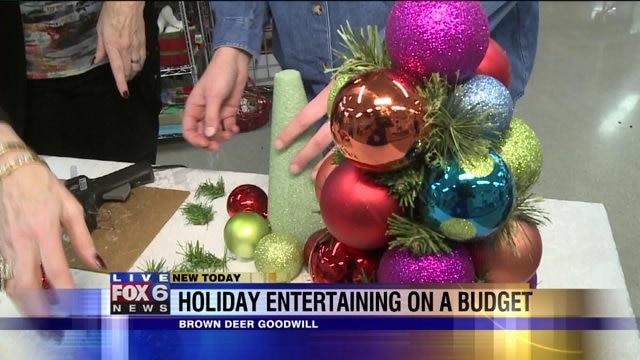 Laura has a blast learning how to make an ornament tree