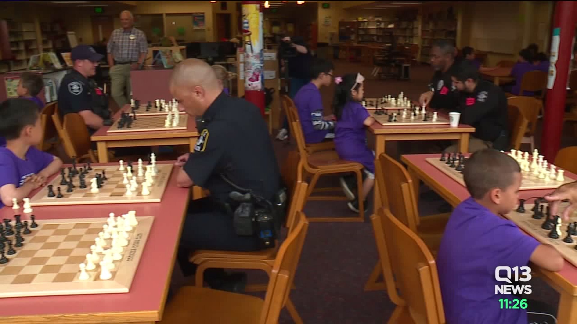 Seahawks linebacker and chess player K.J. Wright joined Seattle Police officers for the 3rd annual Cops and Kids Chess Tournament at Van Asselt Elementary on Tuesday.
