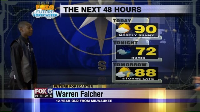 Warren Falcher helps Meteorologist Rob Haswell with the weather