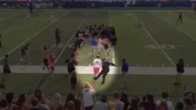 Police officer caught on video tripping students who rushed the field