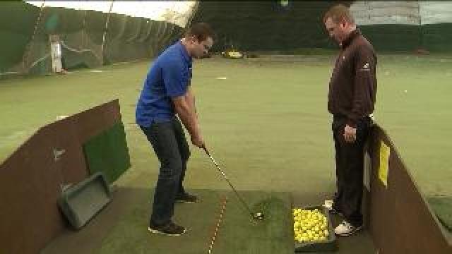 Chip works on his swing at Currie Park Indoor Golf Dome