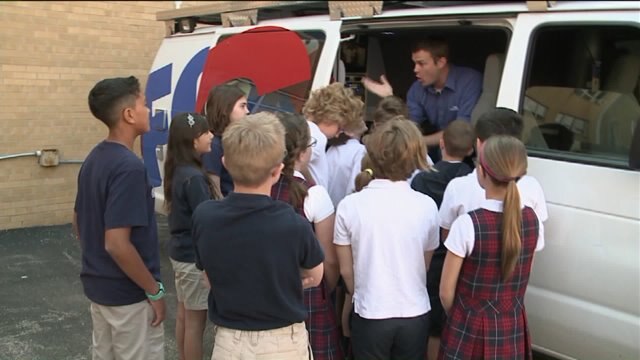 Chip shows students how the FOX6 live truck works
