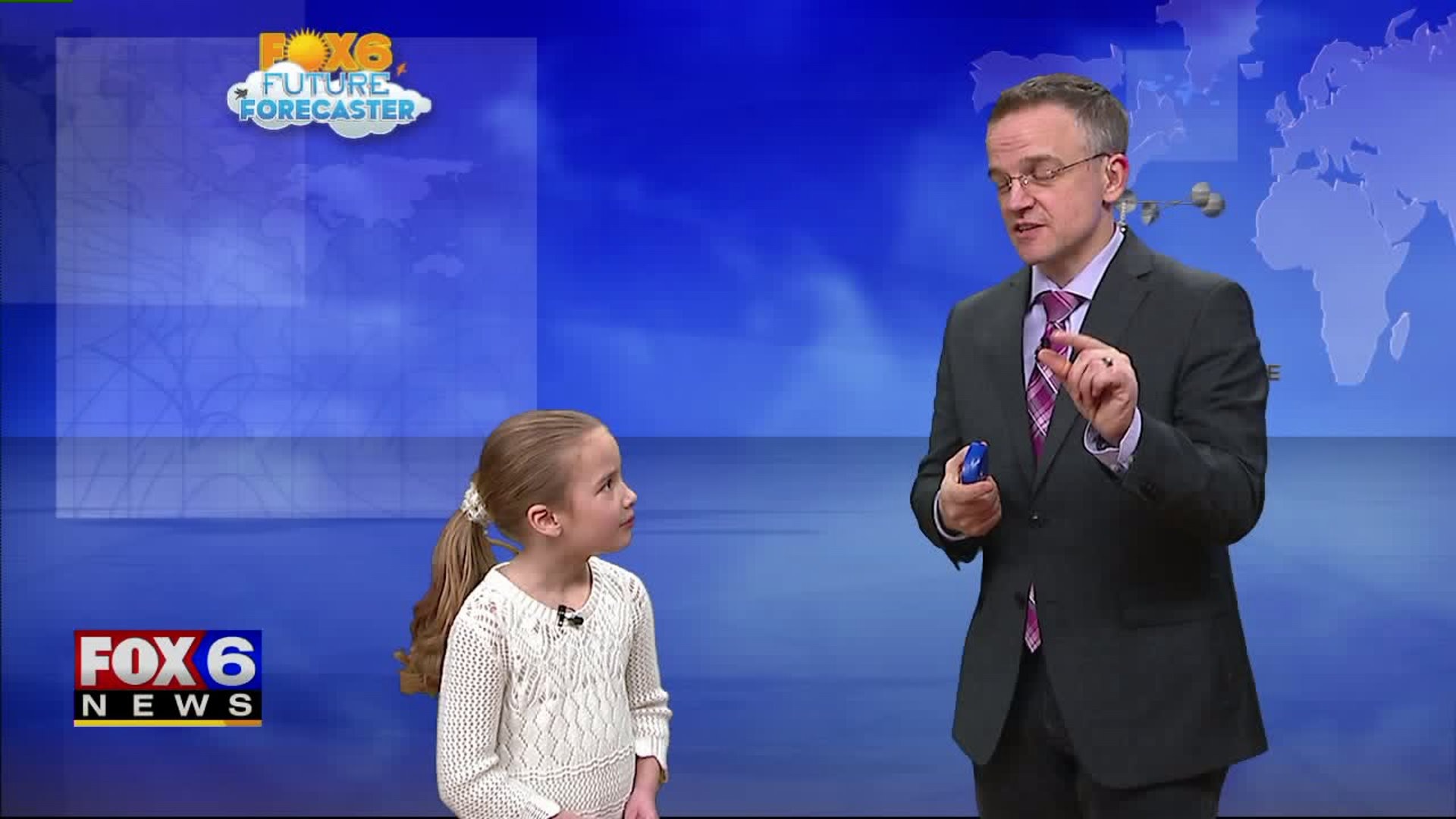 Giana helps Rob with the weather