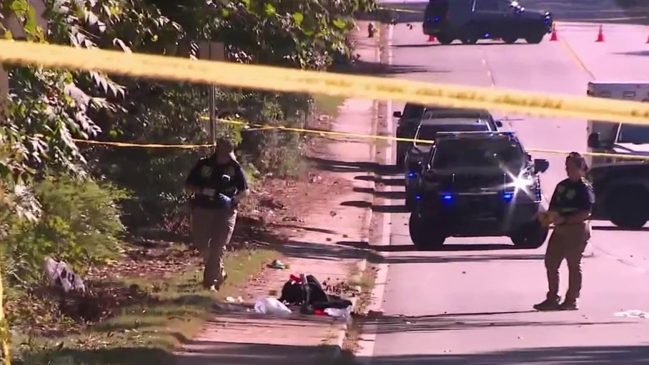 Police shoot armed suspect holding woman and child