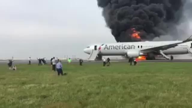 Passengers escape burning plane at Chicago's O'Hare Airport