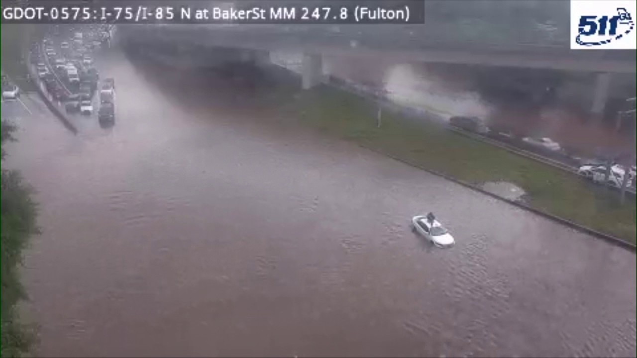 Driver of stranded car rescued from floodwater