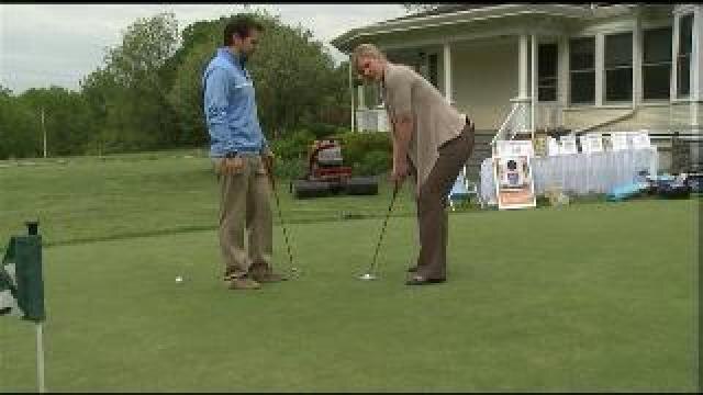Laura works on her putting game