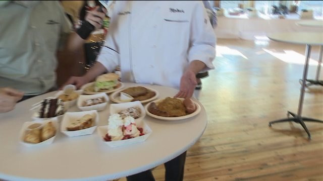 Chip checks out food at Christkindlmarket