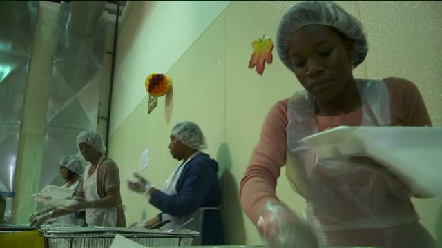 Faithful Mission Pentecostal volunteers serve up a Thanksgiving meal to those in need