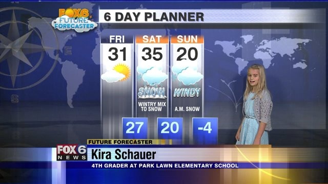 Kira helps Stephanie Barichello with the weather