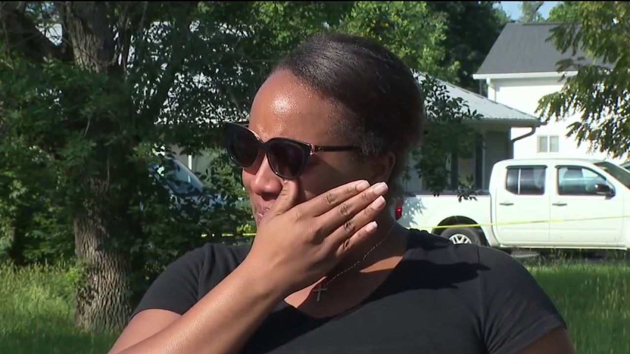 Suburban neighbors distraught after woman killed in shooting crossfire
