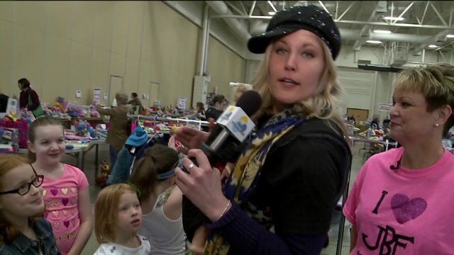 Laura picks children`s clothes she thinks each of the anchors would have worn as a child