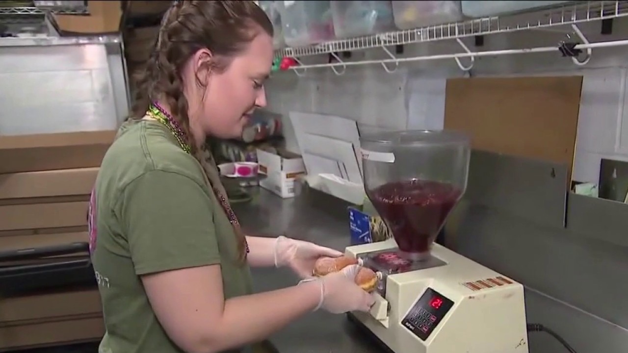 Filling pączki at Aggie's Bakery