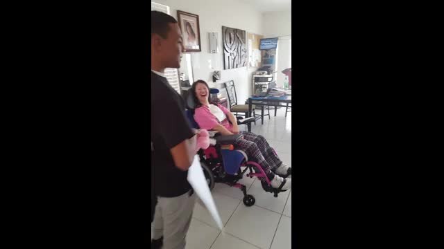 Woman left paralyzed after brutal attack surprised with 'prom-posal:' "The most priceless thing was her smile"
