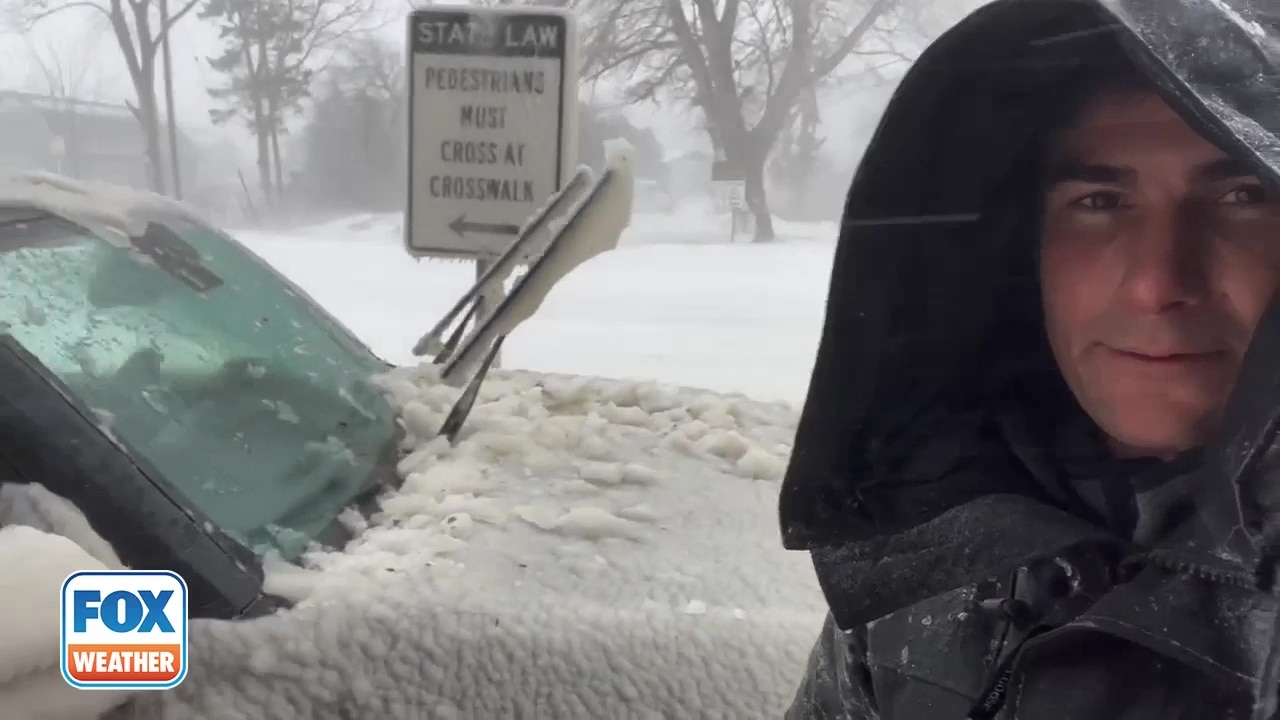 FOX Weather's Max Gorden clears car covered in thick ice in Buffalo