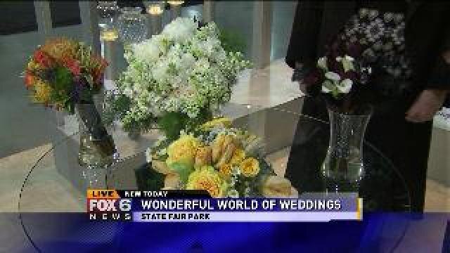 Laura checks out the flowers Wonderful World of Weddings offers