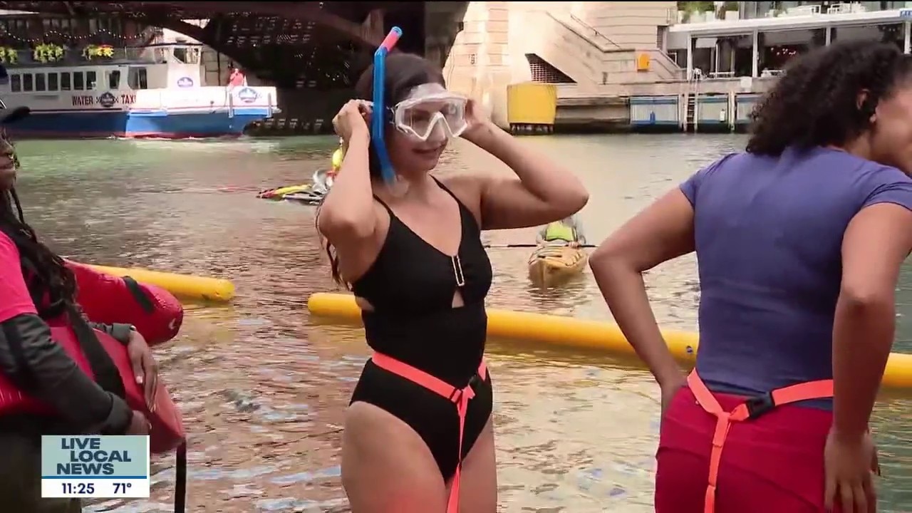 Gabriella Premus jumps in the Chicago River ahead of annual swim event