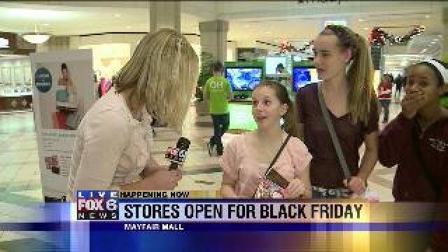 Laura talks with group of teens about their Black Friday shopping