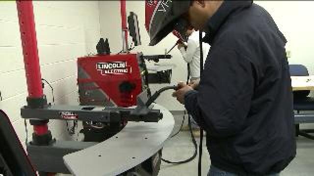 Justin talks with welding instructor