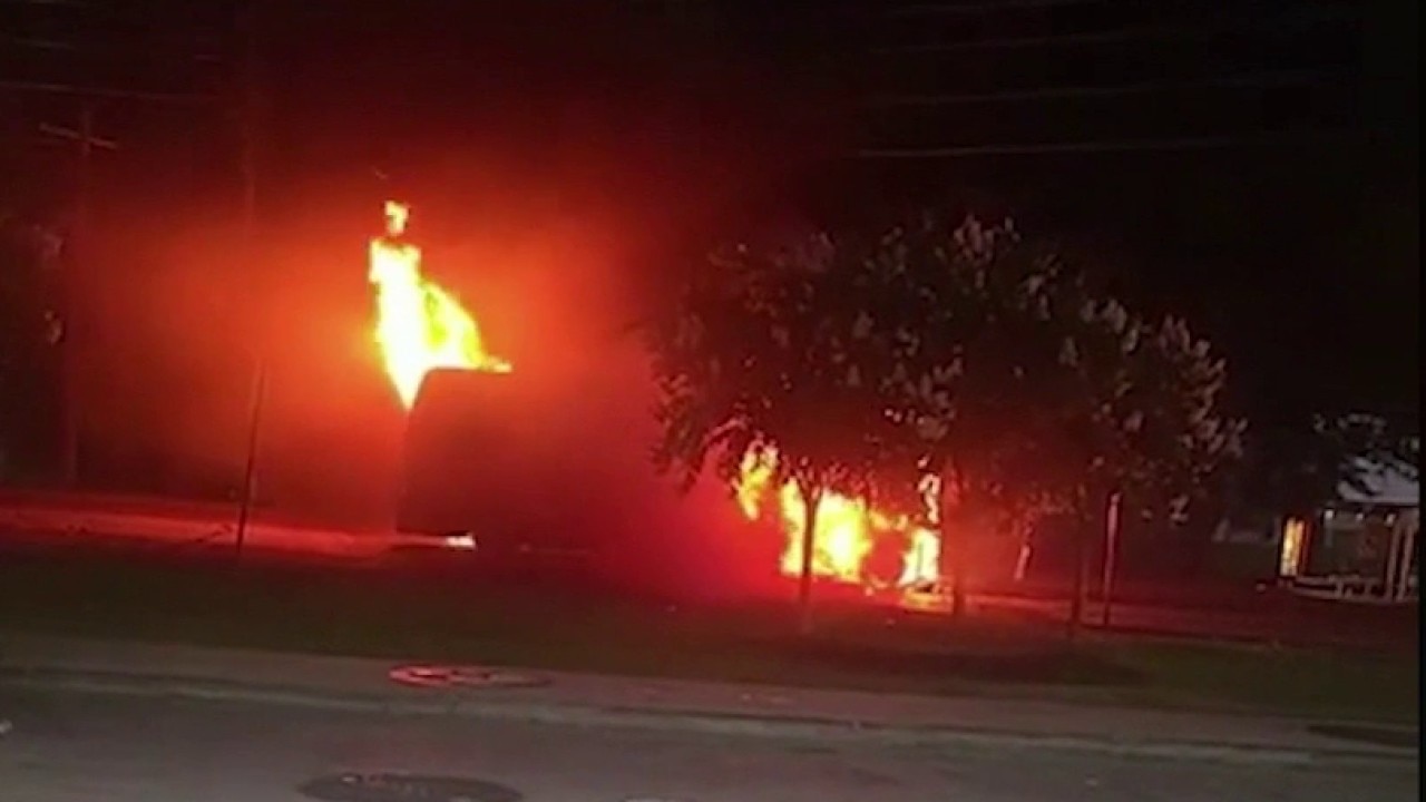 Man saves dog from burning vehicle on busy road