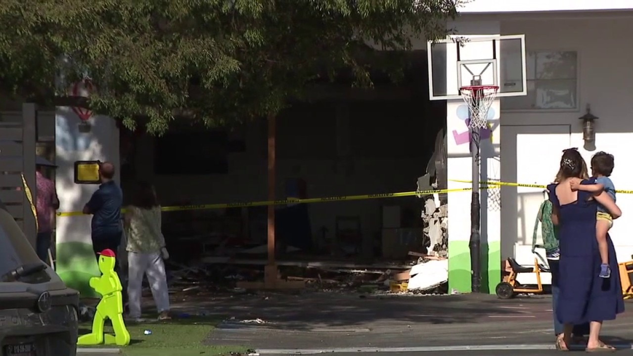 Car crashes into children's play area