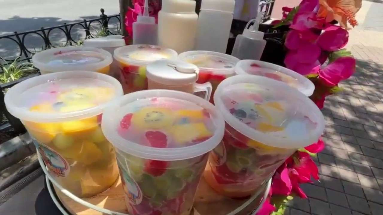 Local entrepreneur beats the heat selling fresh tropical fruit