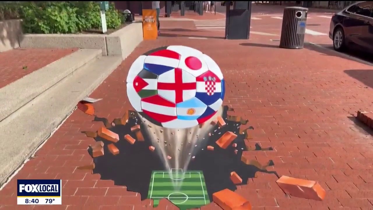 Artist creates sidewalk art for World Cup
