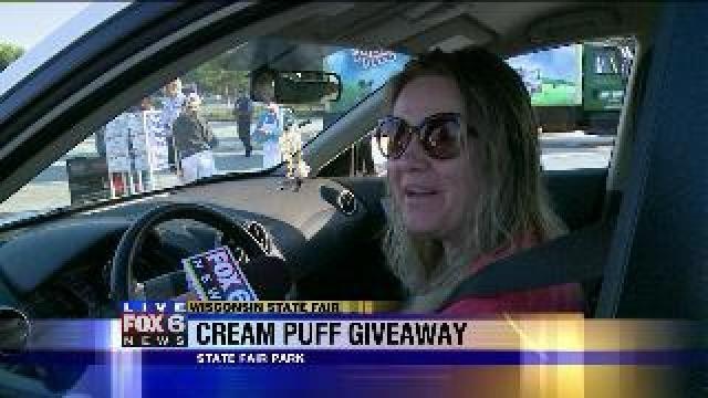 Laura has a blast handing out cream puffs