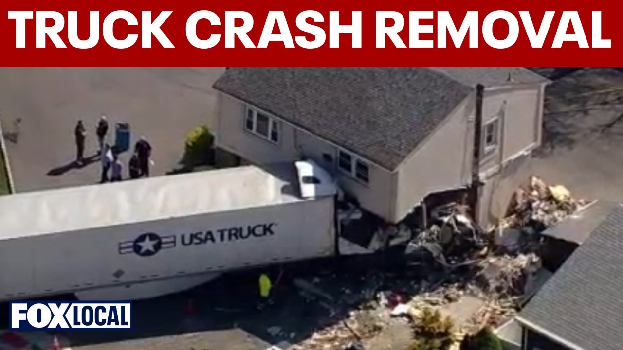 Crews working to remove truck that crashed into building in Clifton, NJ