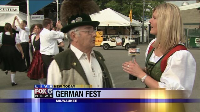 Laura talks with vice president of culture and entertainment at German Fest