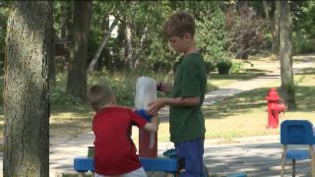 Boys sell lemonade to Harley riders