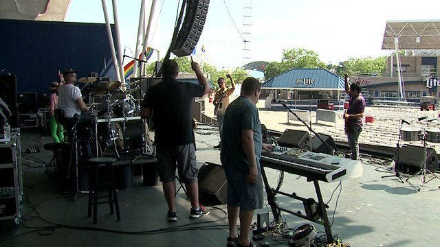 Putting on the finishing touches at PrideFest for the 30th annual celebration