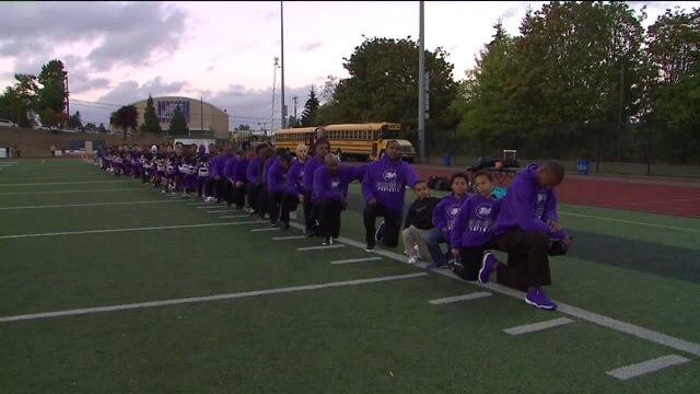 Garfield High kneels