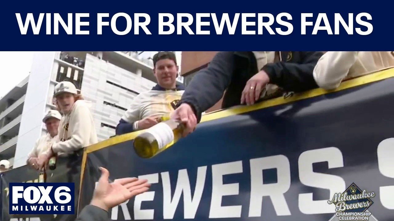 Brewers Championship Parade: Bottles of wine handed to fans