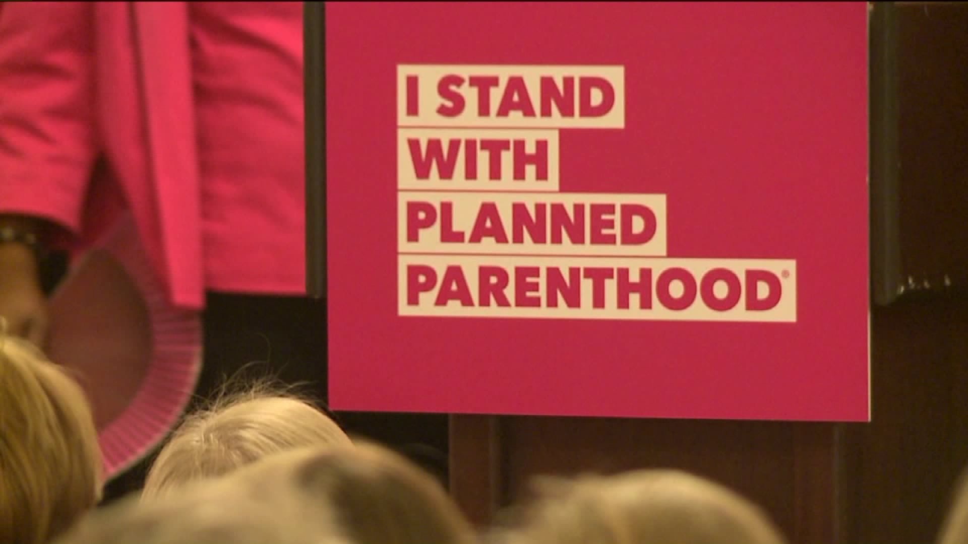 Hundreds of Planned Parenthood supporters rally in downtown Milwaukee