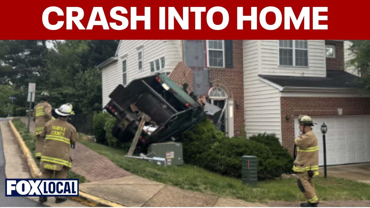 Garbage truck crashes into side of Lorton home
