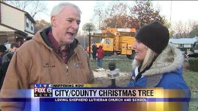 Laura talks with Mayor Barrett about Christmas tree harvest