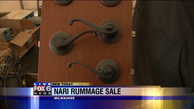 Jessob and Nicole check out items at NARI Rummage Sale