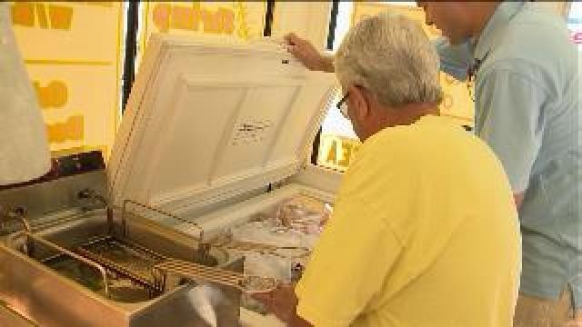 Chip checks out food at South Shore Frolics