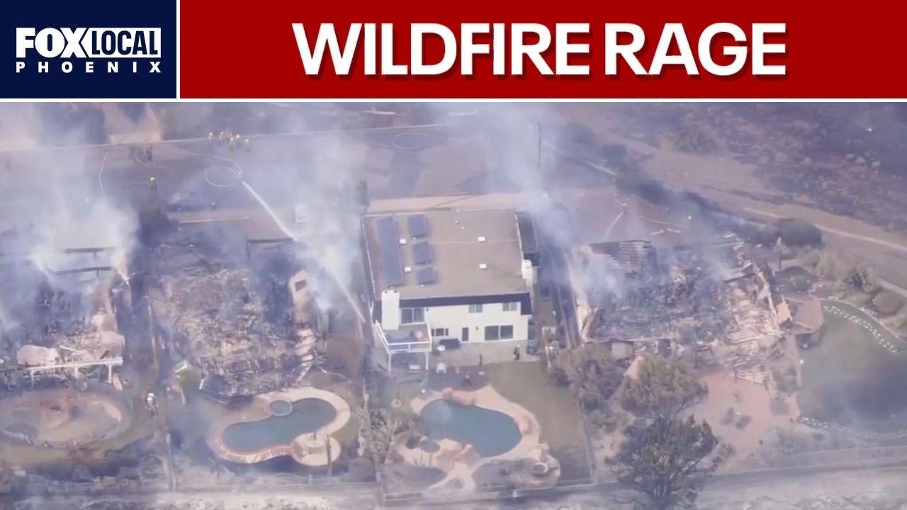 Southern California wildfires force thousands to evacuate as homes burn