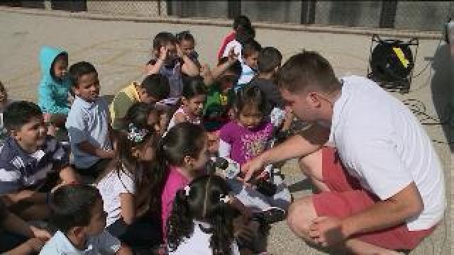 Chip hangs at Escuela Vieau Elementary School for Careers on Wheels