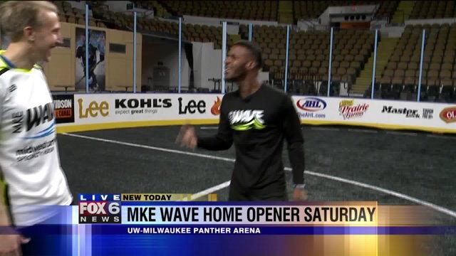 Carl talks with team member about home opener