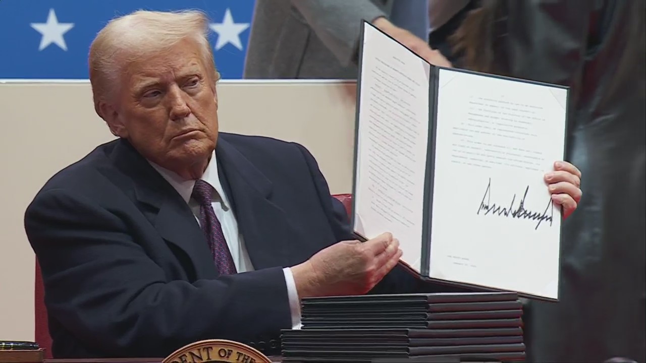 Trump signs dozens of executive orders at Capitol One Arena