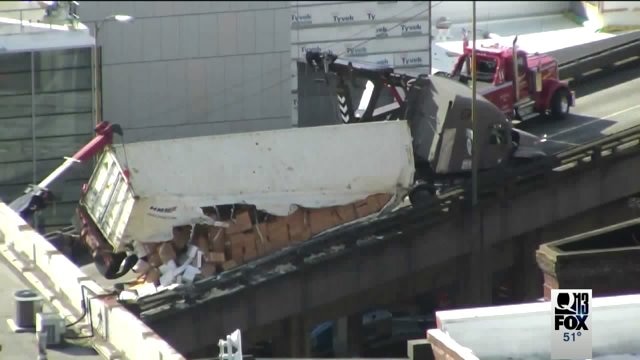 Semi crashes on viaduct, spills boxes of king crab all over