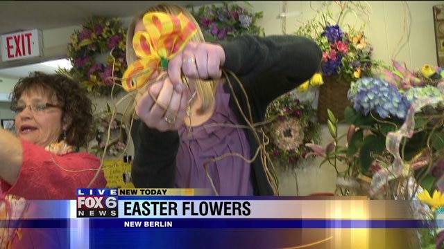 Laura uses purse to make flower arrangement