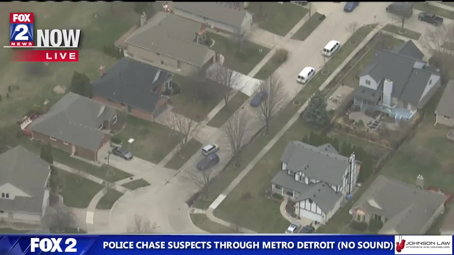 Suspect drives through yards during police chase (Courtesy: WJBK)
